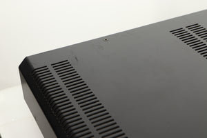 Close up view of a used Roksan Caspian M Series-1 Dual Mono Pre Amplifier in Silver finish showing scratching on the back corner 