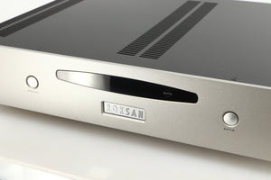 Close up of a used Roksan Caspian MSeries-1 Power Amplifier in a silver finish showing some of the fascia