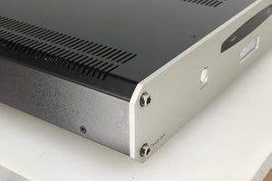 Front left corner of a used Roksan Caspian MSeries-1 Power Amplifier in a silver finish