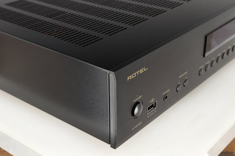 Front left corner of a used Rotel A14 MKII Integrated Amplifier in a black finish