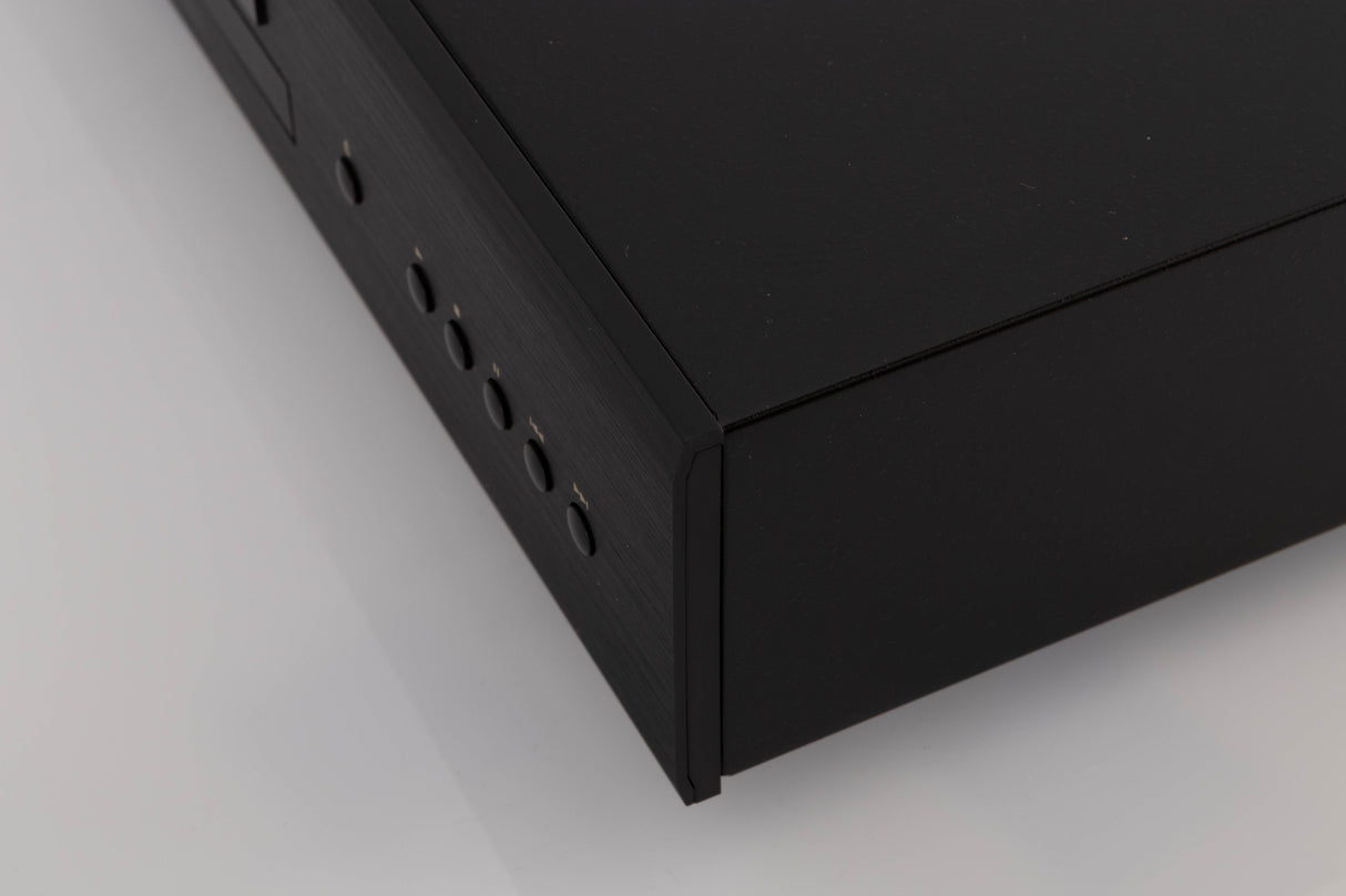Front right corner of a used Rotel CD11 MKII CD Player in a Black finish