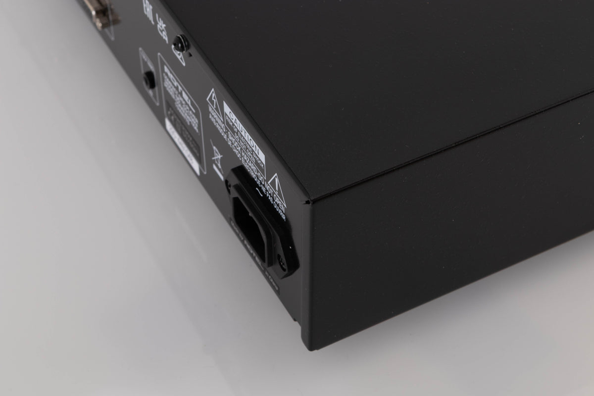 Rear left corner of a used Rotel CD11 MKII CD Player in a Black finish
