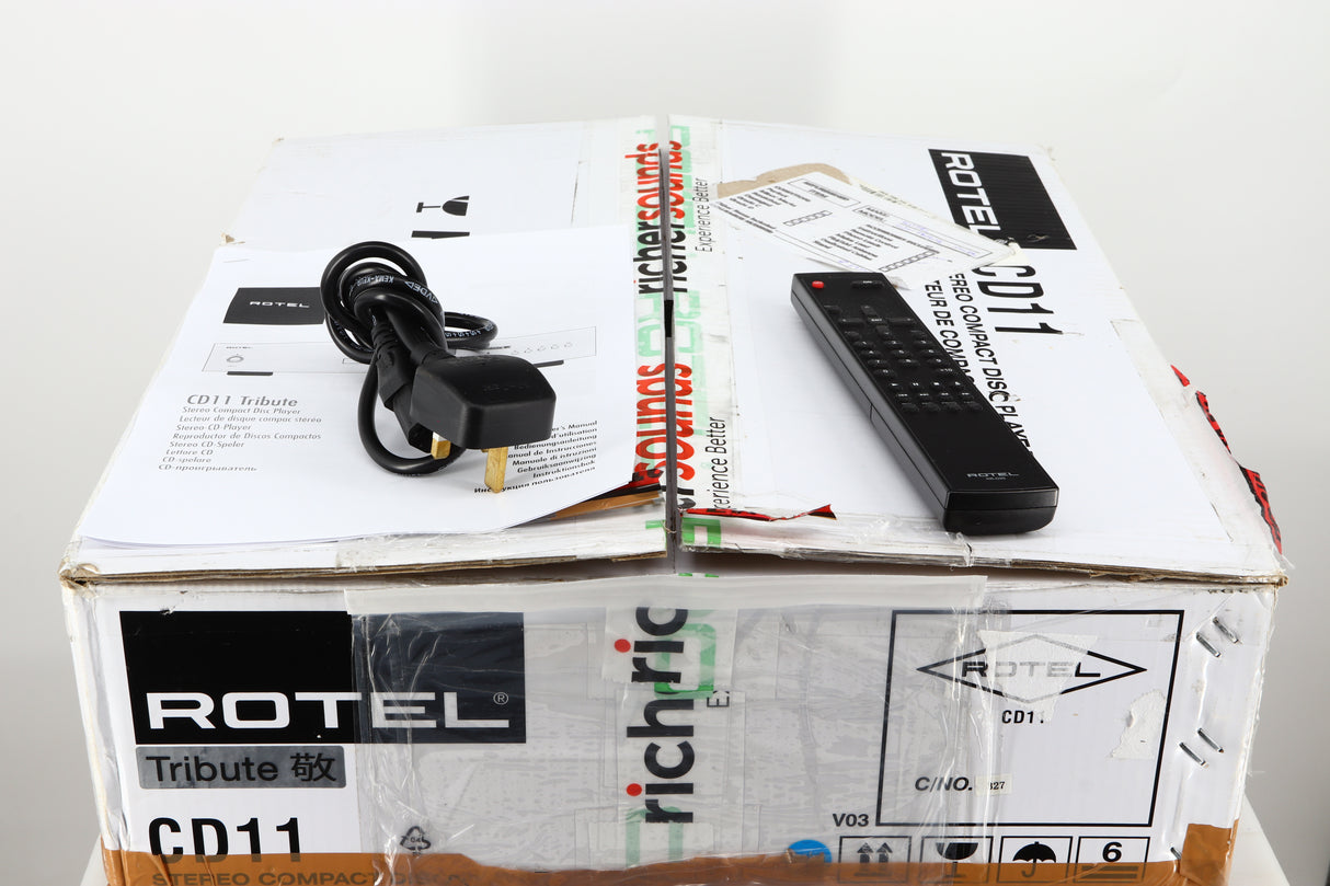 Box for a used Rotel CD11 Tribute CD Player showing Manual, Mains Cable and Remote 