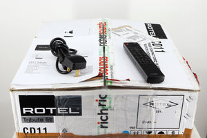 Box for a used Rotel CD11 Tribute CD Player showing Manual, Mains Cable and Remote 