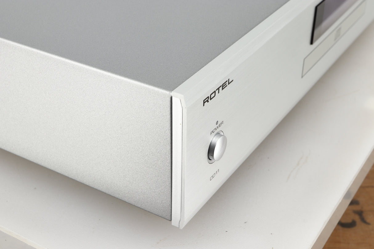 Front left corner of a used Rotel CD11 Tribute CD Player in a silver finish