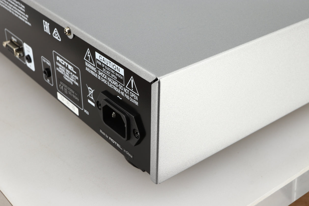 Rear left corner of a used Rotel CD11 Tribute CD Player in a silver finish