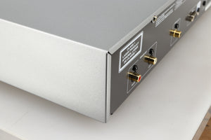 Rear right corner of a used Rotel CD11 Tribute CD Player in a silver finish