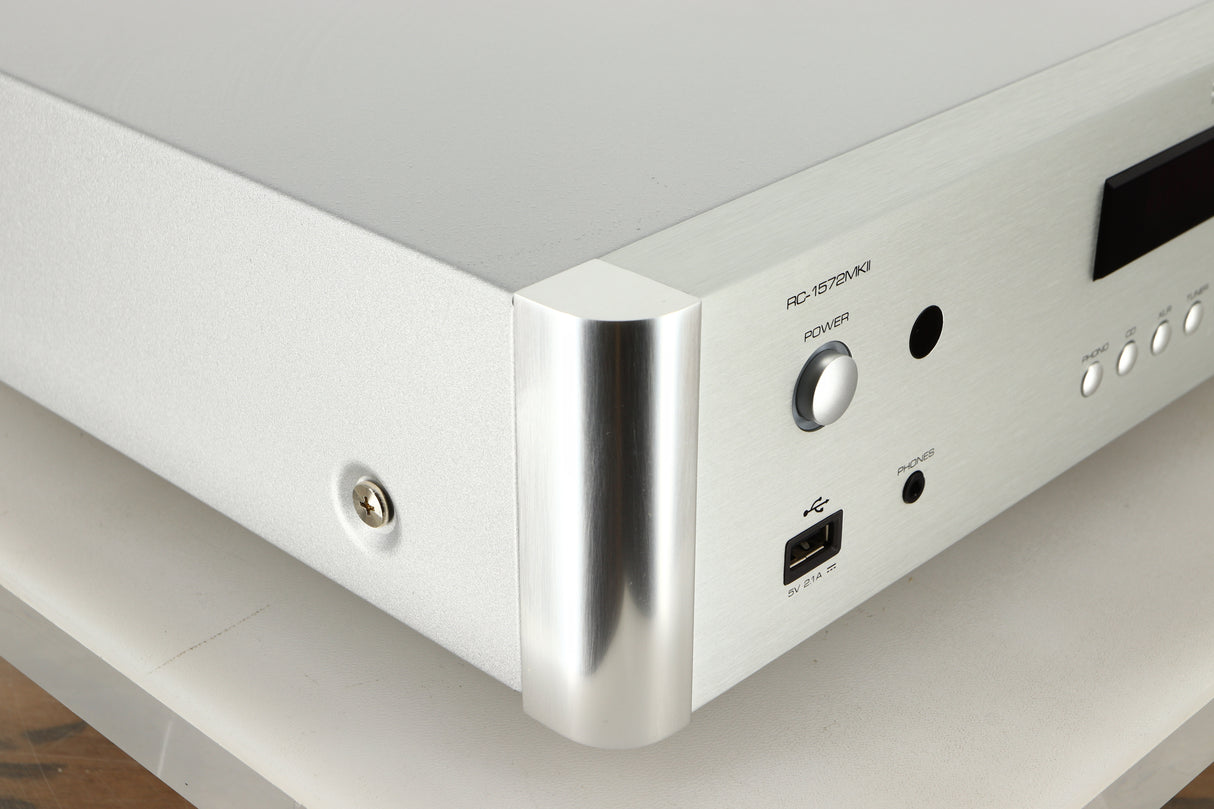 Front left corner view of a used Rotel RC-1572 MKII Pre Amplifier in Silver finish
