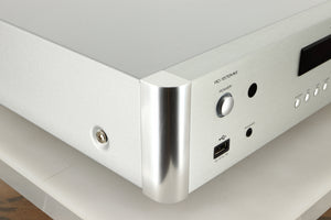 Front left corner view of a used Rotel RC-1572 MKII Pre Amplifier in Silver finish