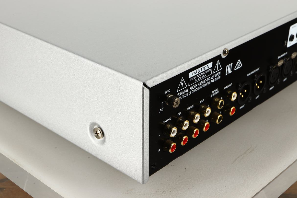 Rear left corner view of a used Rotel RC-1572 MKII Pre Amplifier in Silver finish