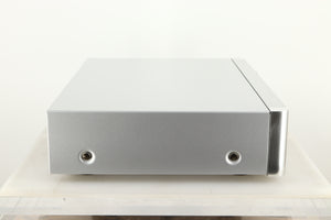 Side view of a used Rotel RC-1572 MKII Pre Amplifier in Silver finish