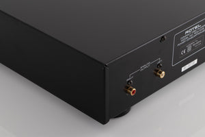 Rear left corner view of a used Rotel RCD-1072 CD Player in Silver