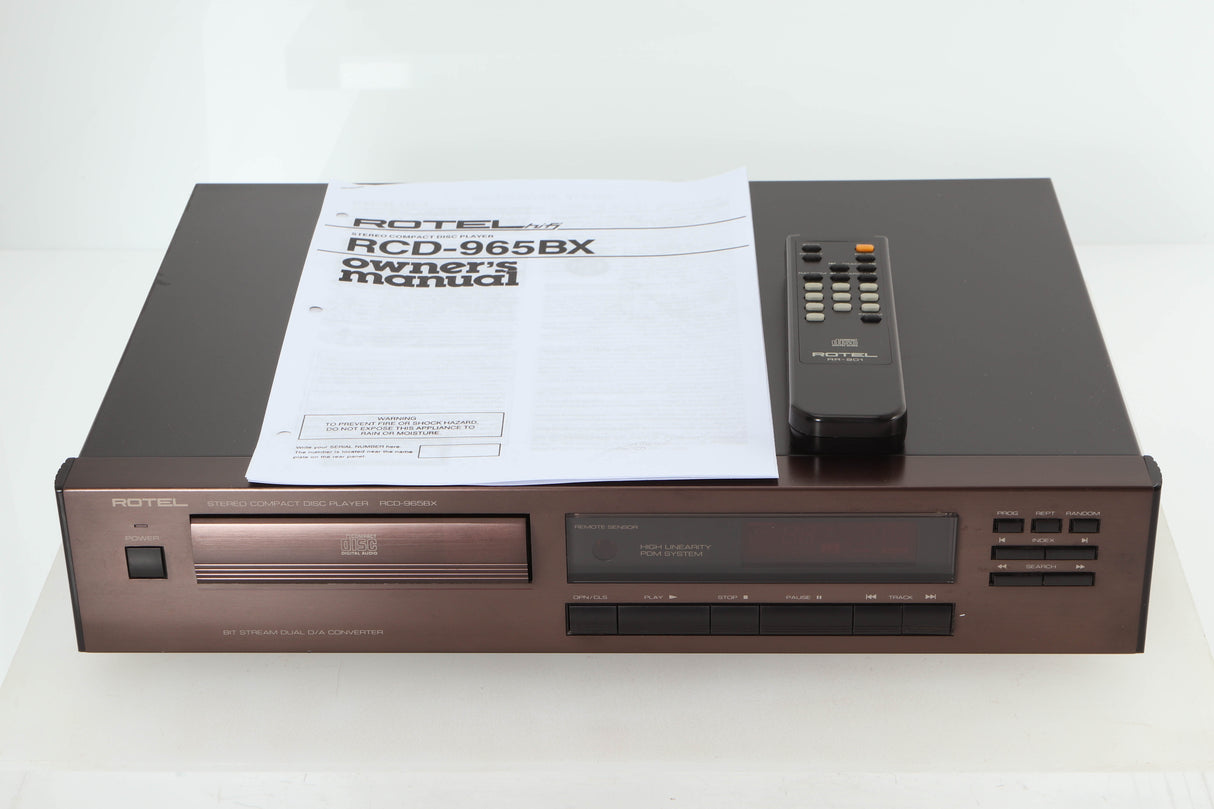 Front view of a used Rotel RCD-965BX CD Player with manual, and remote