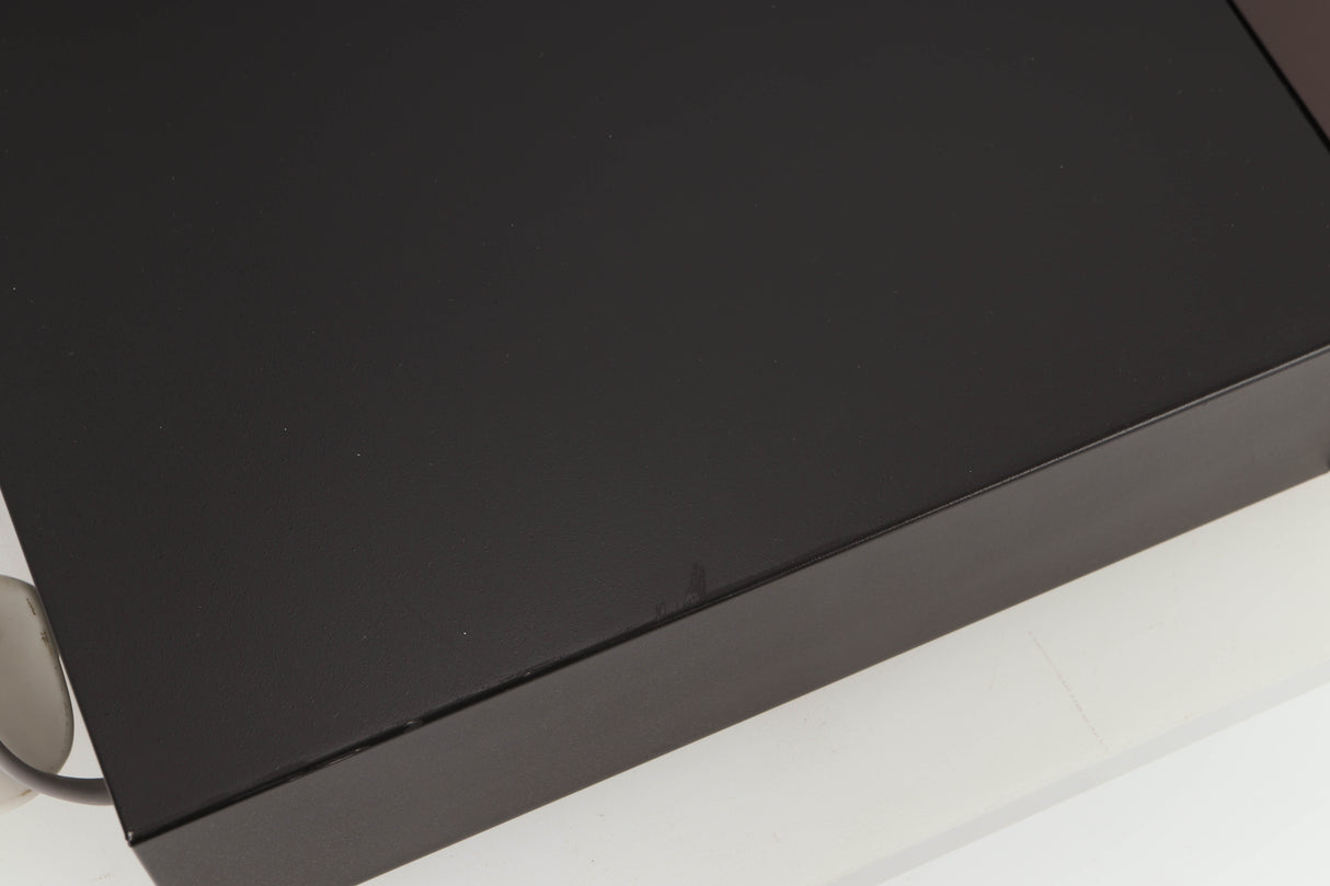 Close up view of a used Rotel RCD-965BX CD Player showing some scratching 