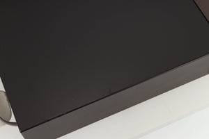 Close up view of a used Rotel RCD-965BX CD Player showing some scratching 