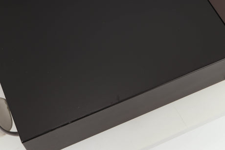 Close up view of a used Rotel RCD-965BX CD Player showing some scratching 