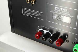 Close up of a used Rotel RMB1075 Power Amplifier in a black finish showing a light scratch on the rear 