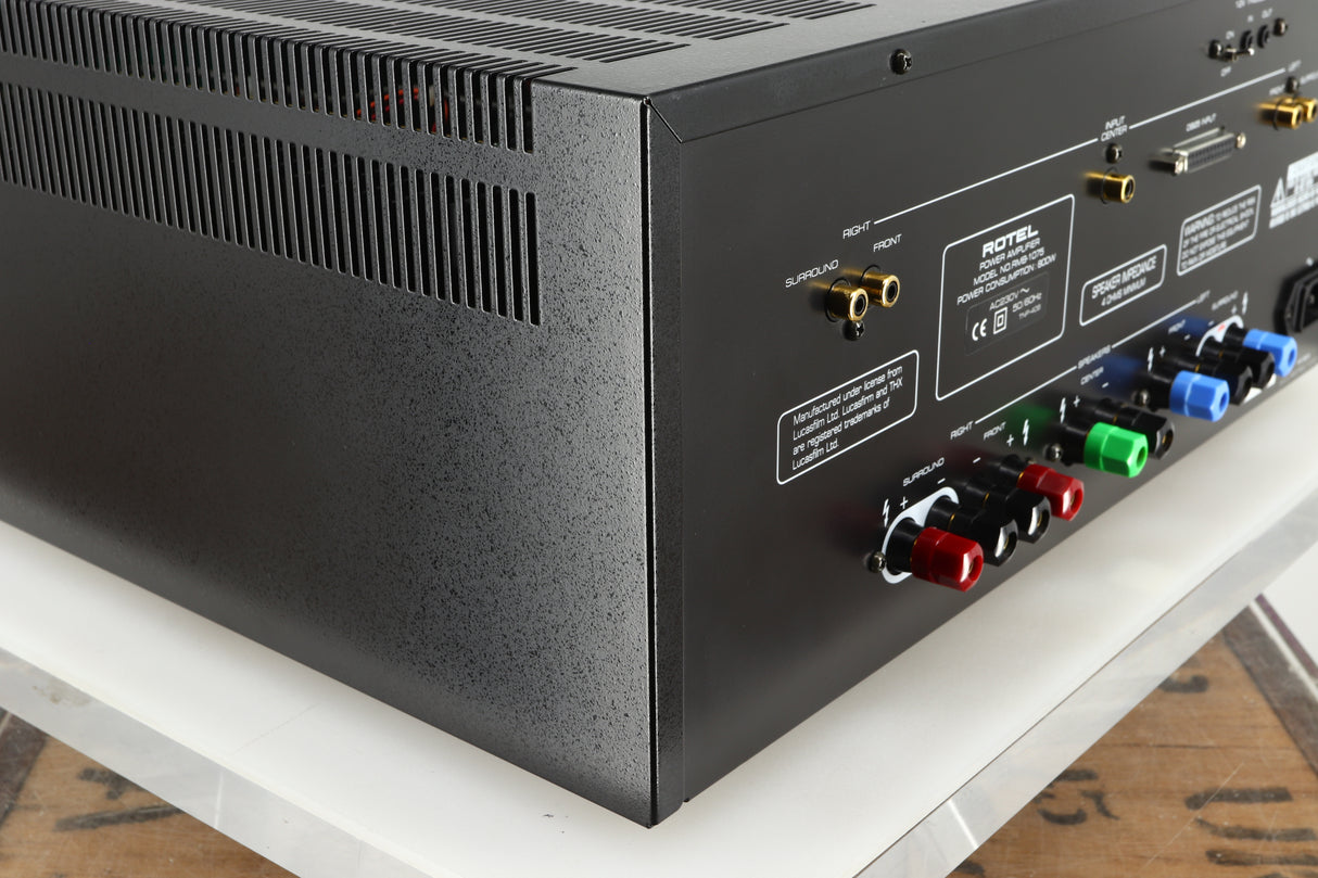 Rear right corner of a used Rotel RMB1075 Power Amplifier in a black finish 