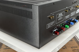 Rear right corner of a used Rotel RMB1075 Power Amplifier in a black finish 