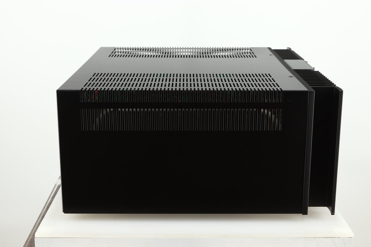 Left side view of a used Rotel RMB1075 Power Amplifier in a black finish 