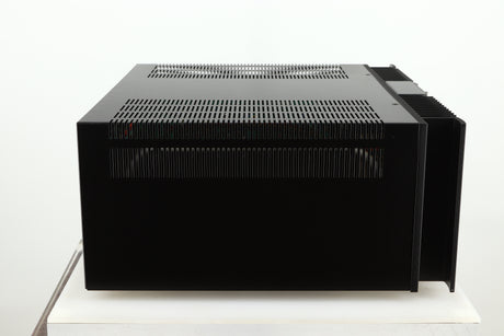 Left side view of a used Rotel RMB1075 Power Amplifier in a black finish 