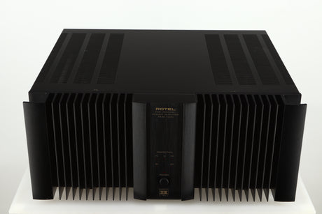 Top view of a used Rotel RMB1075 Power Amplifier in a black finish 