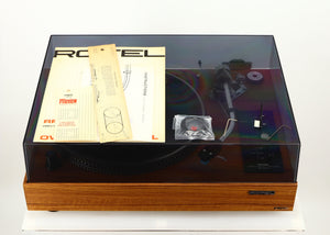 Top of a used Rotel RP-3000 Turntable W/ SME 3009 Series II Improved Tonearm showing Manual, Mounting Template and Cartridge Alignment Protractor, 2x Allen Keys and Brush
