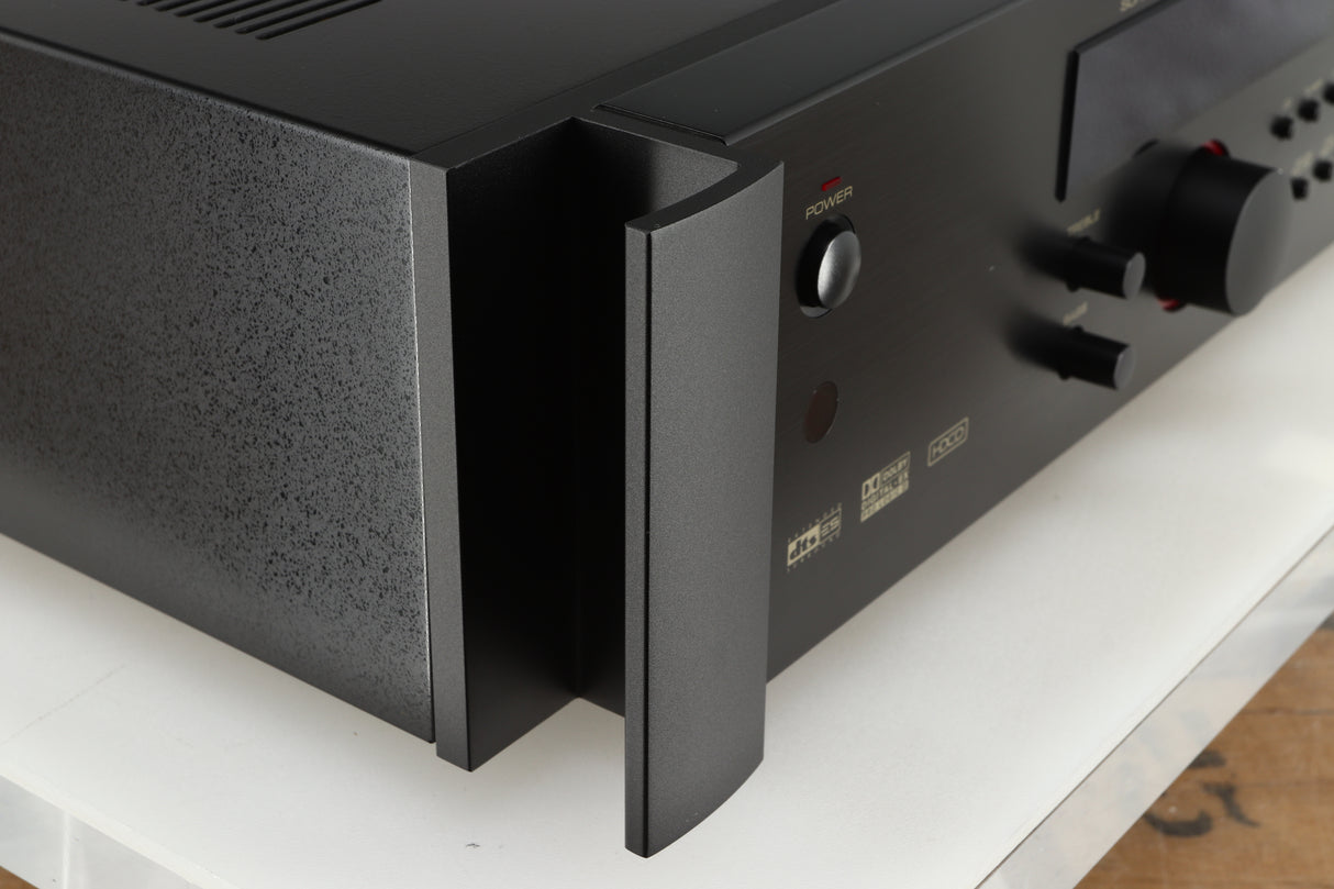 Front left corner of a used Rotel RSP-1066 Pre Amplifier / Processor in a black finish