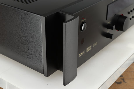 Front left corner of a used Rotel RSP-1066 Pre Amplifier / Processor in a black finish
