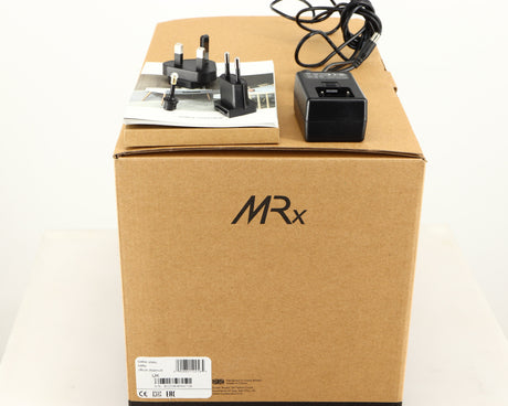 Box for a used Ruark MRX Wireless Speaker in a walnut finish showing PSU, Manual, Mains Plug and Schuko Plug