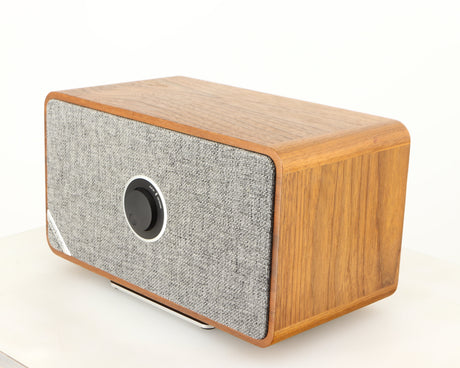 Front right corner of a used Ruark MRX Wireless Speaker in a walnut finish
