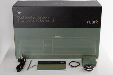 Box of a used Ruark R410 Integrated Music System in Fused Walnut with mains cable, manual, remote, USB-C cable, and antenna