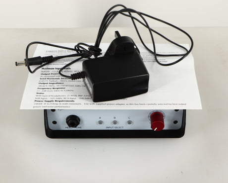 Top of a used Rupert Neve Designs RNHP Precision Headphone Amplifier showing Manual and Power Cable