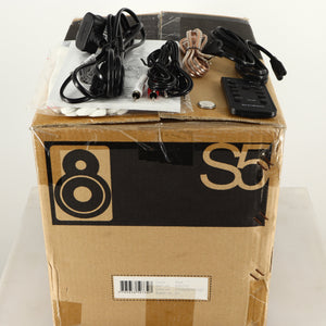 Box for a used Scansonic S5 BT Active Bluetooth Standmount Speakers in a red finish showing Remote, Battery, Power Cable, Schuko Cable, Manual, Gloves, Interconnect Cable and AUX Cable
