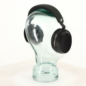 Rear left angle of used Sennheiser Momentum 4 Wireless Headphones in a black finish