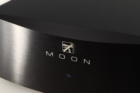 Close up of a used Simaudio Moon 310LP Phono Pre Amplifier in a black finish showing logo on fascia
