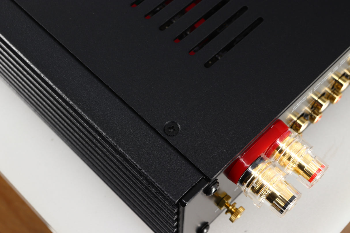 Close up of a used Simaudio Moon 340i D3PX Integrated Amplifier in a black finish showing some light scratches