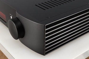 Front right corner of a used Simaudio Moon 340i D3PX Integrated Amplifier in a black finish