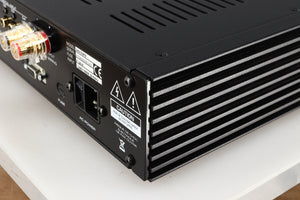 Rear left corner of a used Simaudio Moon 340i D3PX Integrated Amplifier in a black finish