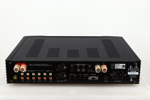 Rear view of a used Simaudio Moon 340i D3PX Integrated Amplifier in a black finish showing Phono Inputs and Outputs, Mains Input, Optical Input and Speaker Inputs