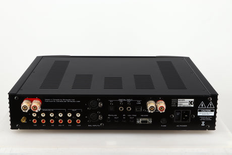 Rear view of a used Simaudio Moon 340i D3PX Integrated Amplifier in a black finish showing Phono Inputs and Outputs, Mains Input, Optical Input and Speaker Inputs