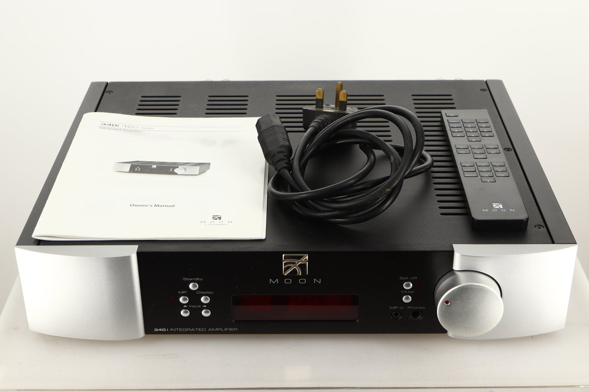 A used SimAudio Moon 340i X Integrated Amplifier in Black/Silver finish with mains cable, manual, and remote