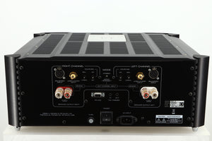 Rear view of a used Simaudio Moon 860A V2 Power Amplifier in black finish showing  mains input, speaker inputs, balanced XLR, and RS 232