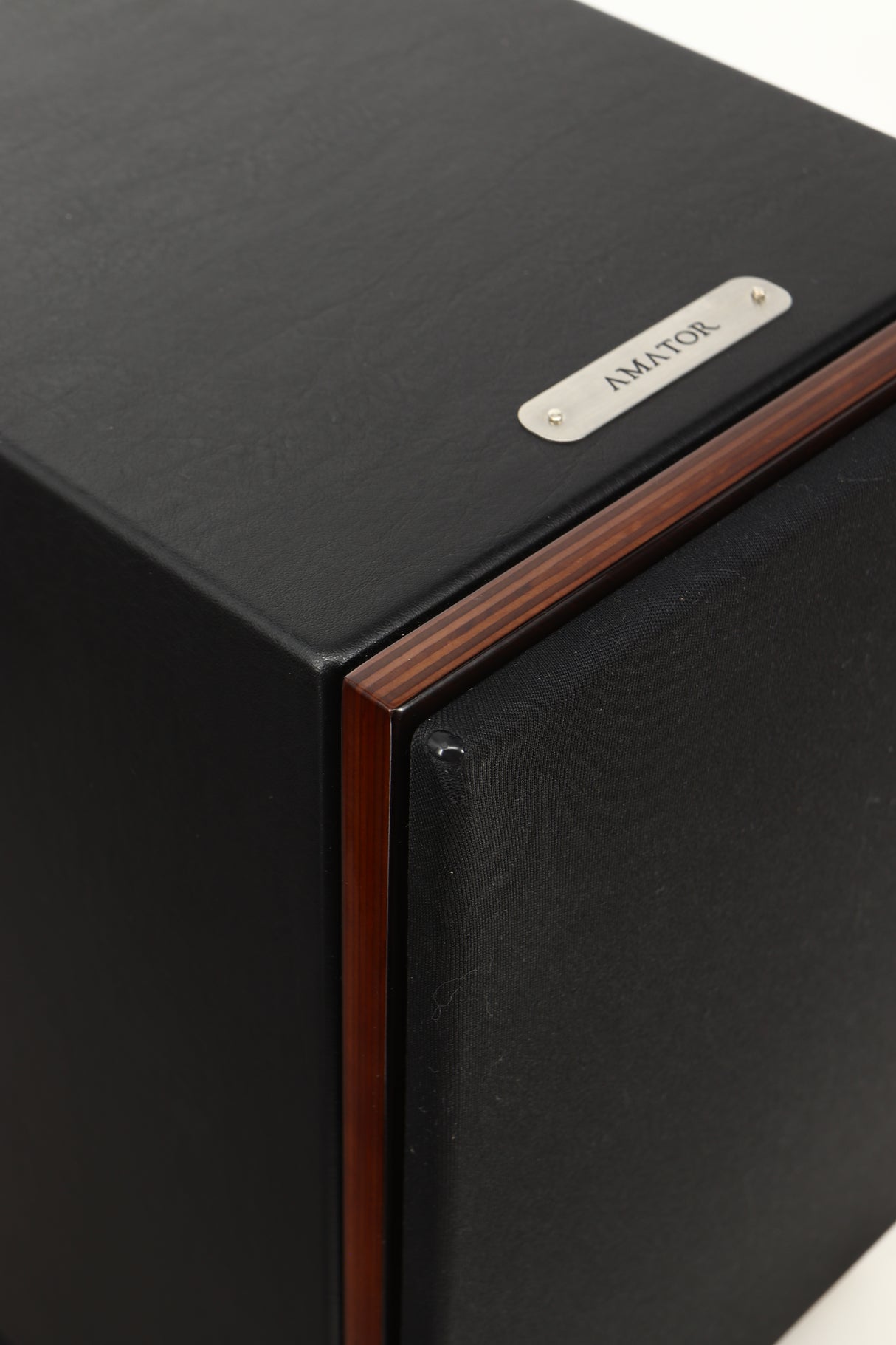 Cloce up view of a used Sonus Faber Lumina II Amator Standmount Speaker in Venge finish showing a small tear on the corner of the grille