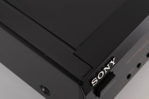 Close up of a used Sony CDP-XE330 CD Player in a Black finish showing scratches on top