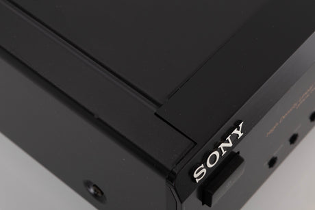 Close up of a used Sony CDP-XE330 CD Player in a Black finish showing scratches on top