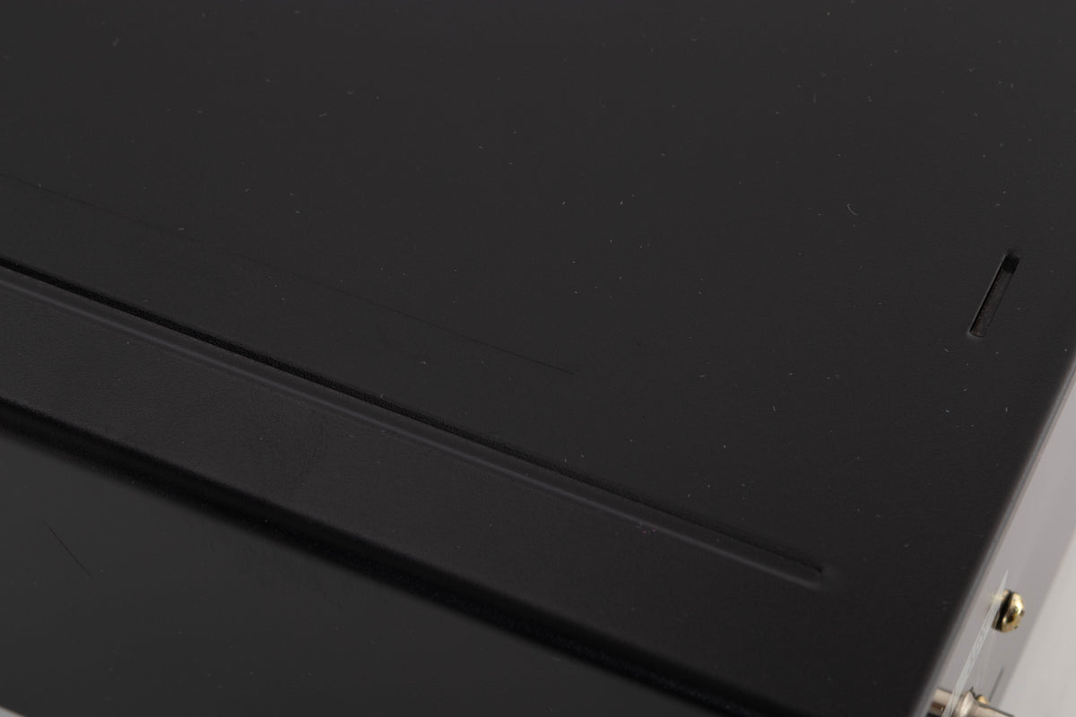 Close up of a used Sony CDP-XE330 CD Player in a Black finish showing scratches on top