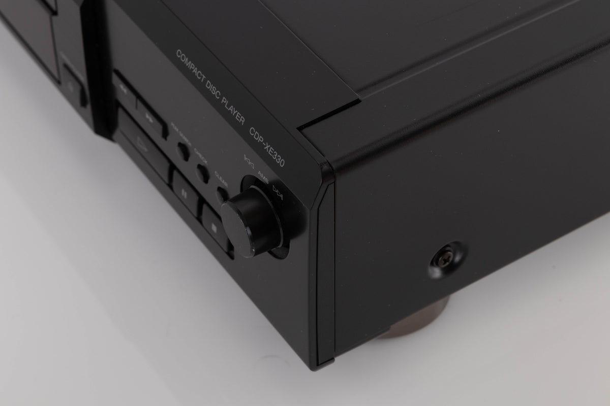 Front right corner of a used Sony CDP-XE330 CD Player in a Black finish