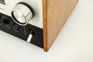 Close up of a used Sony ST-88 Tuner in an oak finish showing some damage on front right corner