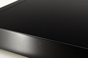 Close up of a used Sony ST-S570ES FM/AM Tuner in a black finish showing scratch on right side